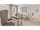 Bright home office with large desk, comfortable chairs, and artwork at 102 Hill Side Ln, Dallas, GA 30157