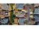 Bird's-eye view of the neighborhood showcases lush landscaping and well-maintained homes on a tree lined street at 12800 Wyngate Trl, Alpharetta, GA 30005