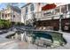 Inviting backyard pool and patio area with a waterfall feature at 12800 Wyngate Trl, Alpharetta, GA 30005