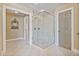 Bright bathroom features a glass shower stall and neutral tile at 12800 Wyngate Trl, Alpharetta, GA 30005