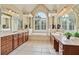Bright bathroom with double sinks, a soaking tub, and refined finishes offers a spa-like experience at 12800 Wyngate Trl, Alpharetta, GA 30005