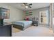 Comfortable bedroom with neutral walls, plush carpet, and a ceiling fan at 12800 Wyngate Trl, Alpharetta, GA 30005