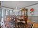 Formal dining room featuring an ornate chandelier, rich wood table, and a decorative rug at 12800 Wyngate Trl, Alpharetta, GA 30005