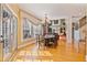 Inviting dining area with natural light, hardwood floors, and an elegant chandelier at 12800 Wyngate Trl, Alpharetta, GA 30005