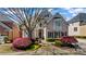 Charming brick home with a landscaped front yard, mature trees, and curb appeal at 12800 Wyngate Trl, Alpharetta, GA 30005