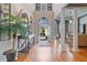 Grand foyer with soaring ceilings, hardwood floors, and abundant natural light at 12800 Wyngate Trl, Alpharetta, GA 30005