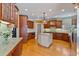 Spacious kitchen with custom cabinetry, granite countertops, and stainless steel appliances at 12800 Wyngate Trl, Alpharetta, GA 30005