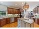 Gourmet kitchen featuring granite countertops, stainless steel appliances, custom cabinetry, and a central island at 12800 Wyngate Trl, Alpharetta, GA 30005