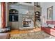 Inviting living room with stone fireplace, built-in shelving, and warm lighting at 12800 Wyngate Trl, Alpharetta, GA 30005