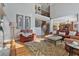 Elegant living room boasts high ceilings, a cozy seating area, and an open floor plan, perfect for entertaining at 12800 Wyngate Trl, Alpharetta, GA 30005