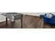 Fun basement area with a foosball table and a comfortable blue velvet sofa and pillows at 2128 Cosette Ln, Kennesaw, GA 30152