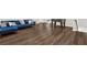 Spacious basement features stunning floors, a blue velvet sofa, and a foosball table for entertainment at 2128 Cosette Ln, Kennesaw, GA 30152