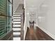 Welcoming foyer with hardwood floors, staircase, and views into the dining area at 2128 Cosette Ln, Kennesaw, GA 30152