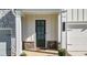 Inviting front entrance showcases a stylish door, stone accents, and well-manicured landscaping at 2128 Cosette Ln, Kennesaw, GA 30152