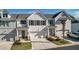 Charming townhome featuring a welcoming front exterior, private driveways, and attached garages at 2128 Cosette Ln, Kennesaw, GA 30152