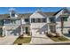 Beautiful exterior of a townhome with a driveway, garage, and well-maintained landscaping at 2128 Cosette Ln, Kennesaw, GA 30152