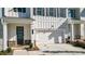 Attractive exterior view highlighting the architectural details, garage, and well-kept lawn at 2128 Cosette Ln, Kennesaw, GA 30152
