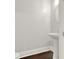 A clean half bathroom featuring a pedestal sink, toilet, and modern fixtures at 2128 Cosette Ln, Kennesaw, GA 30152