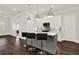 Modern kitchen features a gray island with bar stool seating, pendant lighting, and stainless steel appliances at 2128 Cosette Ln, Kennesaw, GA 30152