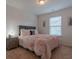 Comfortable bedroom featuring a window and neutral color scheme at 3137 Spicy Cedar Ln, Stonecrest, GA 30038