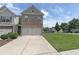 Attractive two-story home with a brick facade and a two-car garage at 3137 Spicy Cedar Ln, Stonecrest, GA 30038