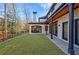 Inviting backyard with an outdoor kitchen and covered patio, perfect for alfresco dining and relaxation at 835 Kenry Ct, Atlanta, GA 30342