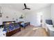 Bright bedroom with wood floors, ceiling fan, and two beds adorned with Mario-themed decor at 835 Kenry Ct, Atlanta, GA 30342