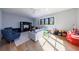 Spacious bonus room with comfortable seating, entertainment center, and natural light at 835 Kenry Ct, Atlanta, GA 30342