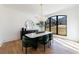 Bright dining room featuring modern lighting fixture, large window, and stylish decor at 835 Kenry Ct, Atlanta, GA 30342