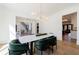 Elegant dining area with stylish chandelier, marble top table, and decorative accents at 835 Kenry Ct, Atlanta, GA 30342