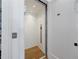 Residential elevator with wood floors and a minimalist design, providing easy access between levels at 835 Kenry Ct, Atlanta, GA 30342