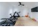 Home gym with exercise equipment, hardwood floors and natural light at 835 Kenry Ct, Atlanta, GA 30342