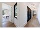Hallway with hardwood floors, white walls, and access to various rooms at 835 Kenry Ct, Atlanta, GA 30342