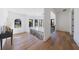 Upstairs hallway featuring hardwood floors, black trim windows, and a stylish console table at 835 Kenry Ct, Atlanta, GA 30342