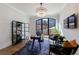 Bright home office with a large window, contemporary decor, and stylish chandelier at 835 Kenry Ct, Atlanta, GA 30342