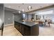 Spacious open floor plan with large kitchen island, adjacent to dining and living area at 835 Kenry Ct, Atlanta, GA 30342