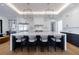 Gourmet kitchen with large center island, modern lighting, and plenty of counter space at 835 Kenry Ct, Atlanta, GA 30342