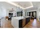Large kitchen island with stainless steel appliances and modern lighting at 835 Kenry Ct, Atlanta, GA 30342
