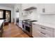 Bright white kitchen with stainless steel appliances and hardwood floors at 835 Kenry Ct, Atlanta, GA 30342