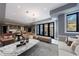 Bright open floor plan with comfortable furniture, large windows, and hardwood floors at 835 Kenry Ct, Atlanta, GA 30342