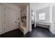 Organized mudroom featuring custom built-ins, herringbone floors, and a desk area at 835 Kenry Ct, Atlanta, GA 30342