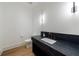 Stylish powder room with modern vanity and sleek lighting fixtures at 835 Kenry Ct, Atlanta, GA 30342