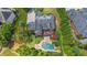A stunning home with a backyard oasis, featuring a pool and a spa at 1391 Harris Rd, Lawrenceville, GA 30043