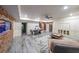 Finished basement featuring wainscoting, exposed brick, an aquarium, and a pool table at 1391 Harris Rd, Lawrenceville, GA 30043