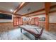 Basement game room with a pool table, exposed brick and wood trim at 1391 Harris Rd, Lawrenceville, GA 30043