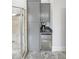 Bathroom cabinetry next to a shower featuring a refrigerator and coffee maker on the counter at 1391 Harris Rd, Lawrenceville, GA 30043