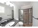 Modern bathroom features a glass-enclosed shower, stylish fixtures, and ample natural light at 1391 Harris Rd, Lawrenceville, GA 30043