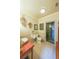 Bright bathroom with a glass shower, wood accents, a mounted sink and matching toilet at 1391 Harris Rd, Lawrenceville, GA 30043
