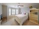 Charming bedroom featuring a cozy bed, window seat, and natural light at 1391 Harris Rd, Lawrenceville, GA 30043