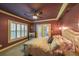 A large primary bedroom with a ceiling fan and access to a balcony at 1391 Harris Rd, Lawrenceville, GA 30043